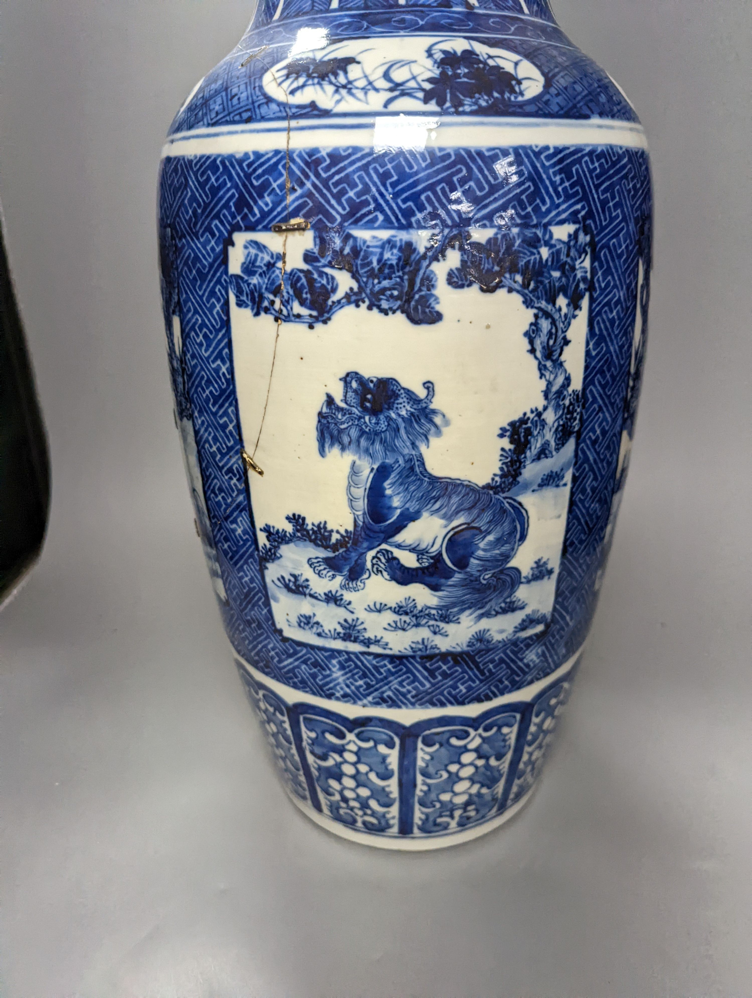 A pair of large early 20th century Chinese Blue and white ‘mythical beast’ vases, 60 cms high.